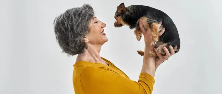 lady smiling at dog