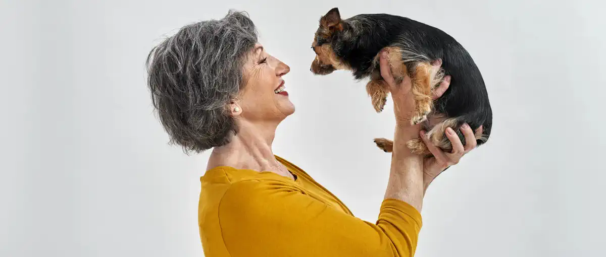 lady smiling at dog